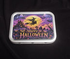 Happy Halloween metal trinket tin featuring a witch flying across the moon, pumpkins and a haunted house