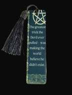 Bookmark with tassel and quote on a wooden surface