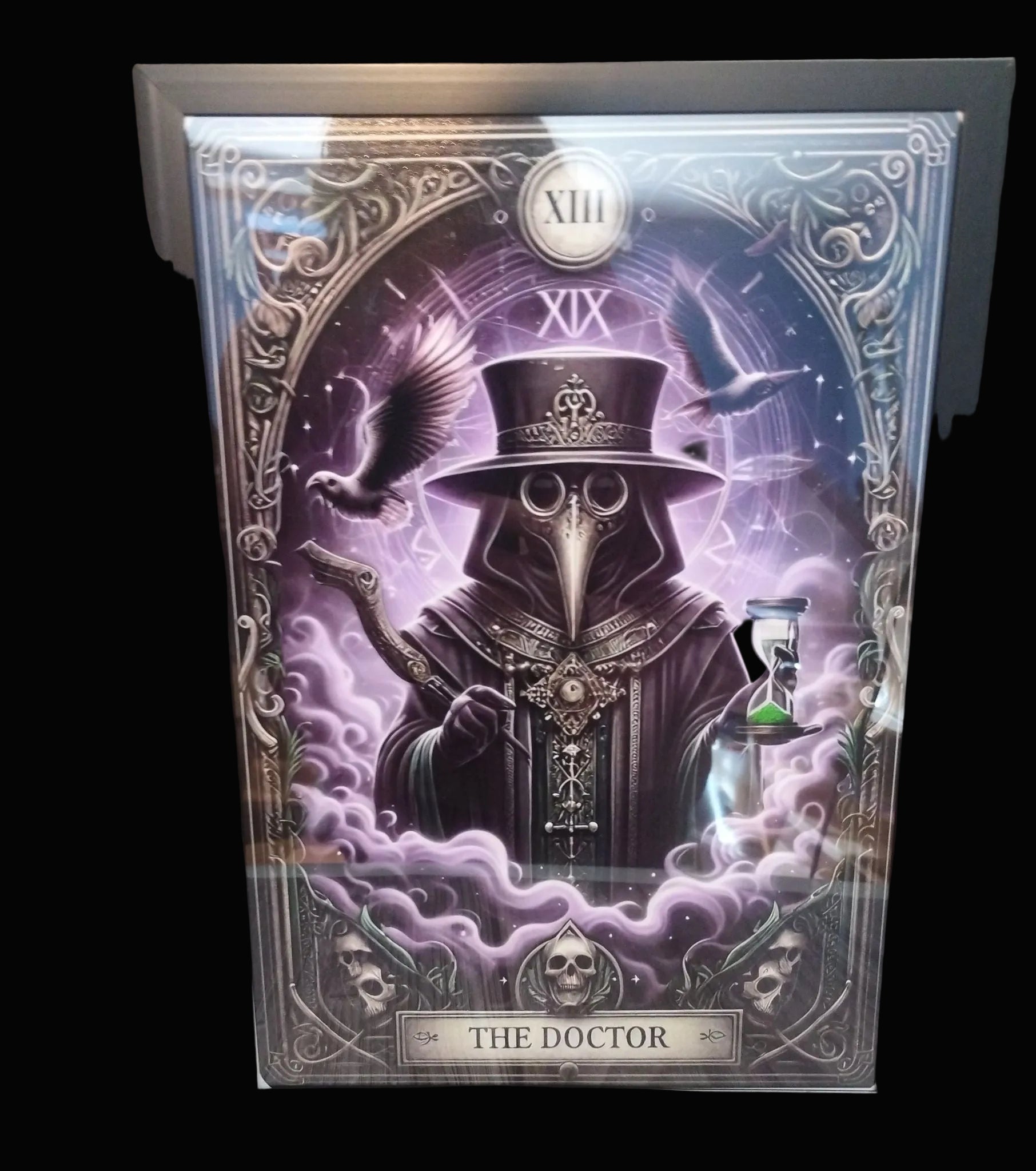 Framed artwork titled 'The Doctor' with a gothic figure and ornate design.