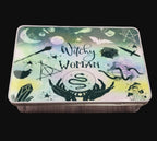 Tin box with 'Witchy Woman' design on a wooden surface