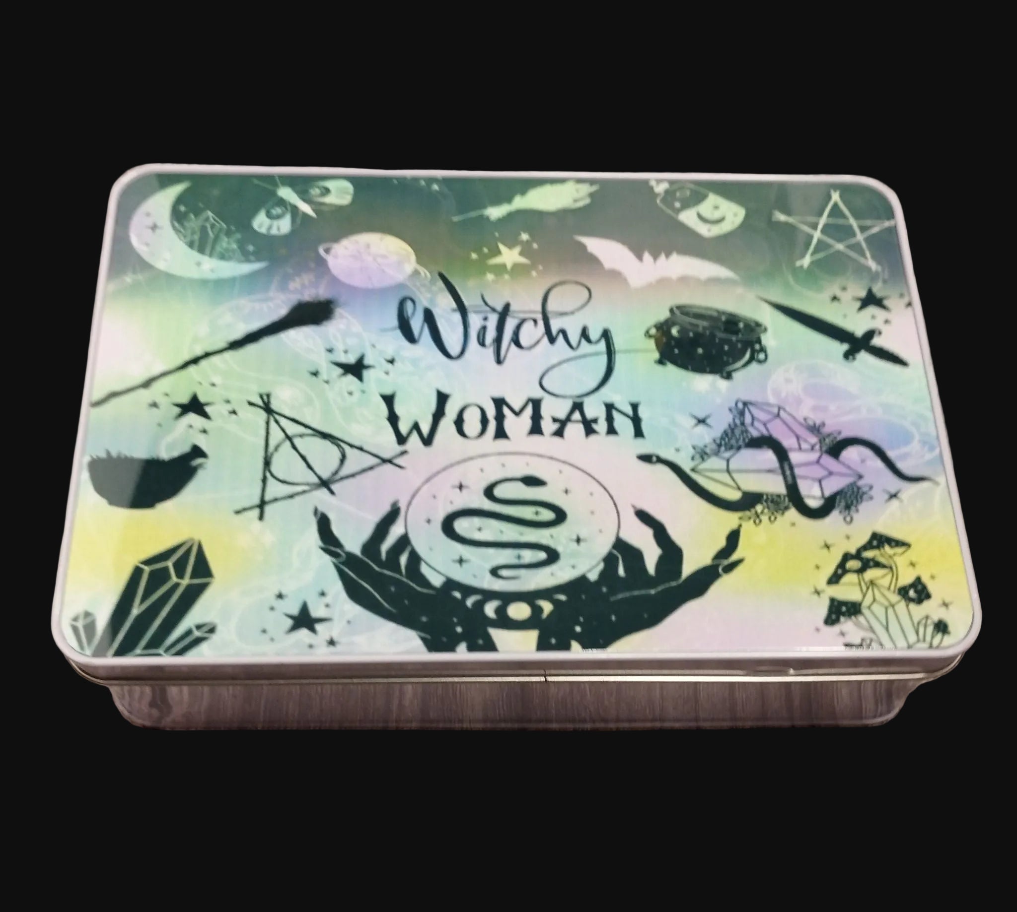 Tin box with 'Witchy Woman' design on a wooden surface