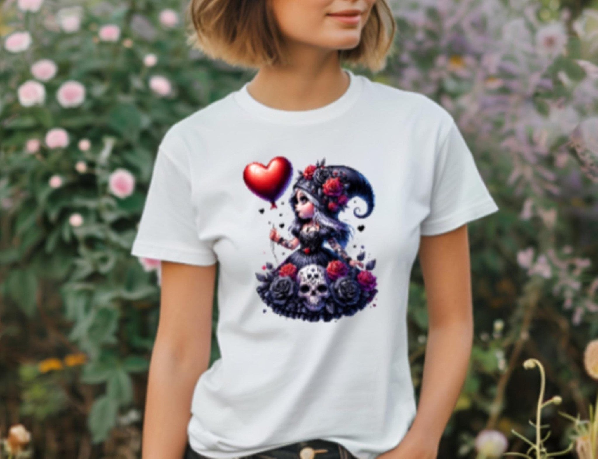 Person wearing a white t-shirt with a colorful graphic design in a garden setting