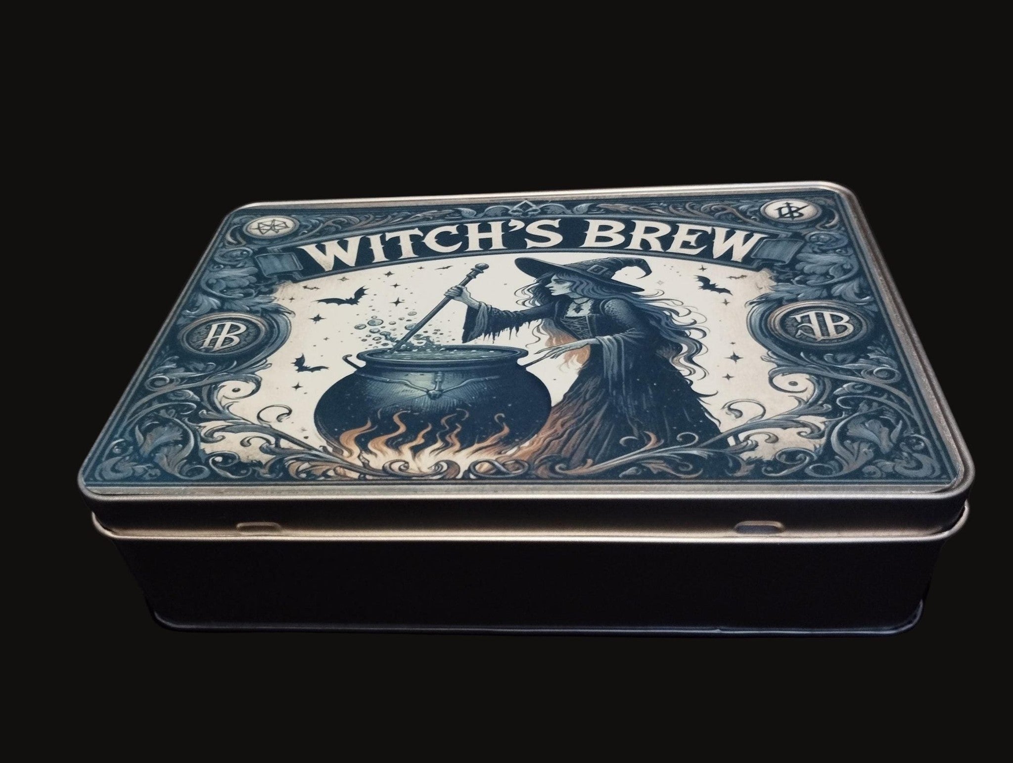 Tin box with 'Witch's Brew' design featuring a witch and cauldron on a black background