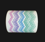 Roll of tape with 'No Time for Bullshit' text in various colors on a wooden surface.