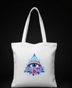 White tote bag with a colorful pyramid and eye design on a black background
