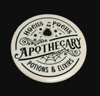 Hocus Pocus Apothecary round ceramic coaster with potion bottle and spider web design