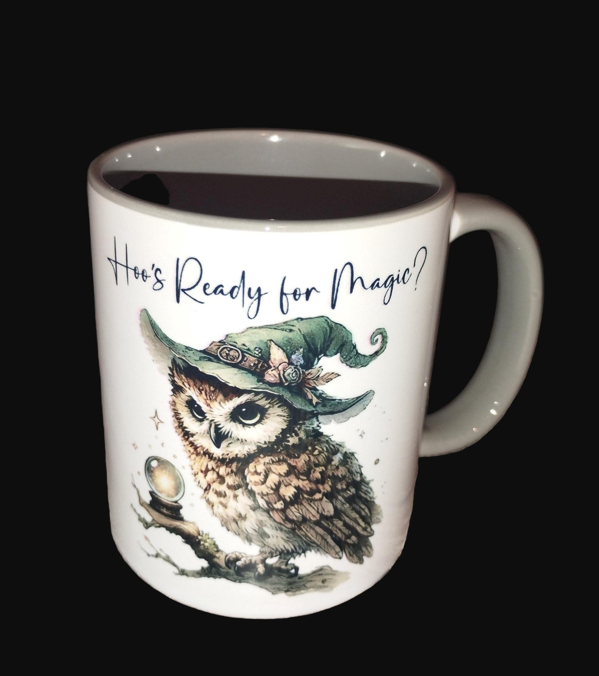Mug with owl design and text 'Are You Ready for Magic?' on a wooden surface.