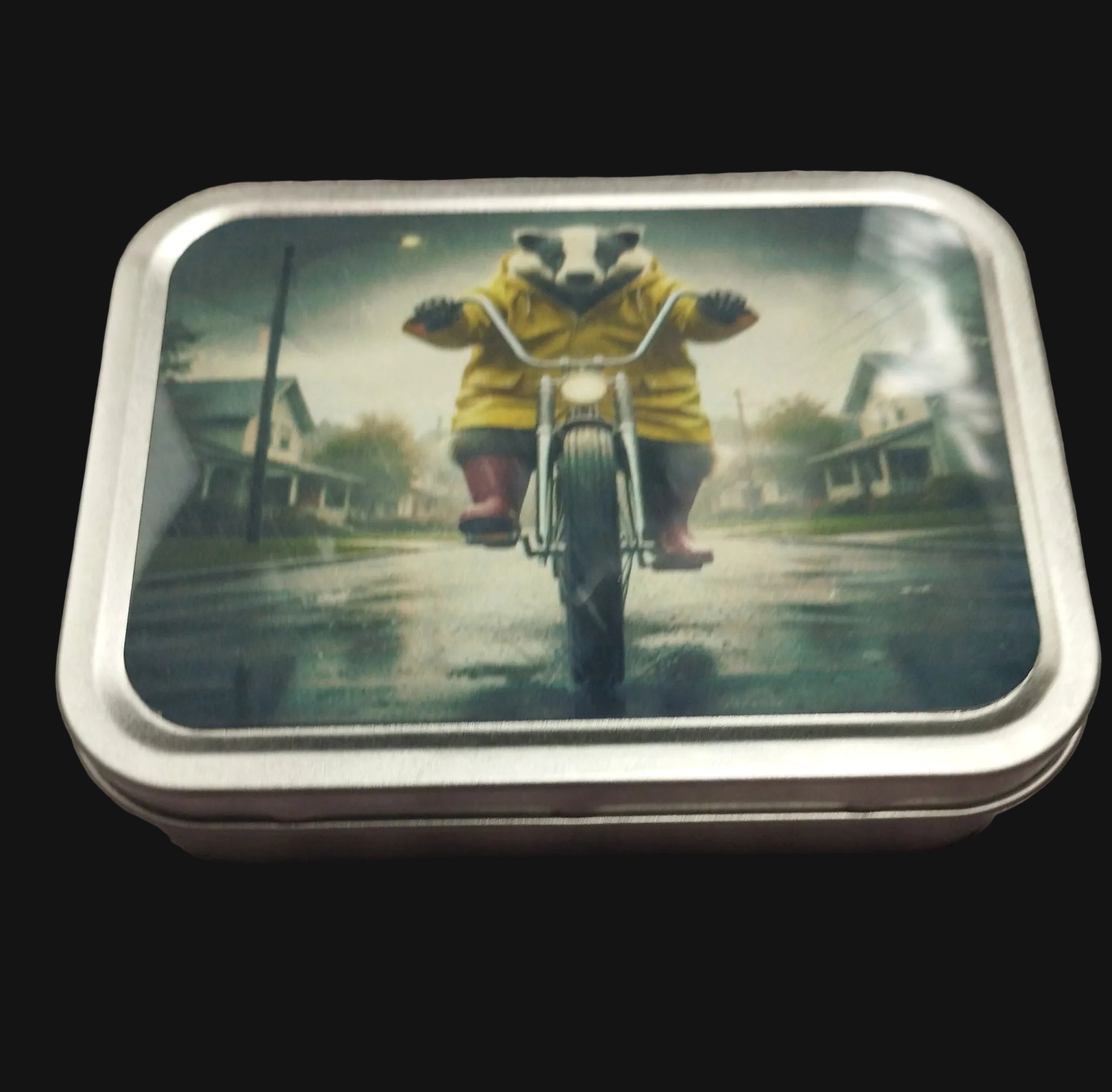 Metallic tin with a panda in a yellow raincoat riding a bike on a rainy street scene.