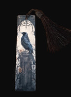 Bookmark with a crow design on a wooden surface