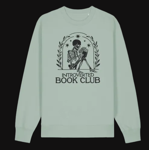 Light green long-sleeve shirt with 'Introverted Book Club' design on a white background