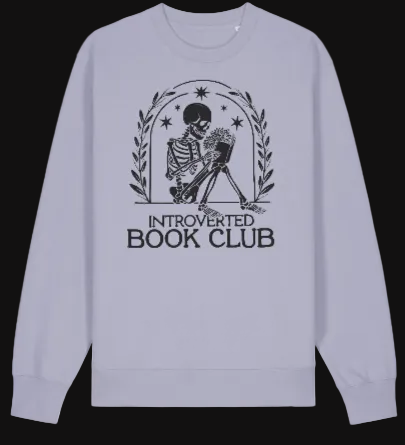 Light purple sweatshirt with skeleton graphic and 'Introverted Book Club' text on a white background