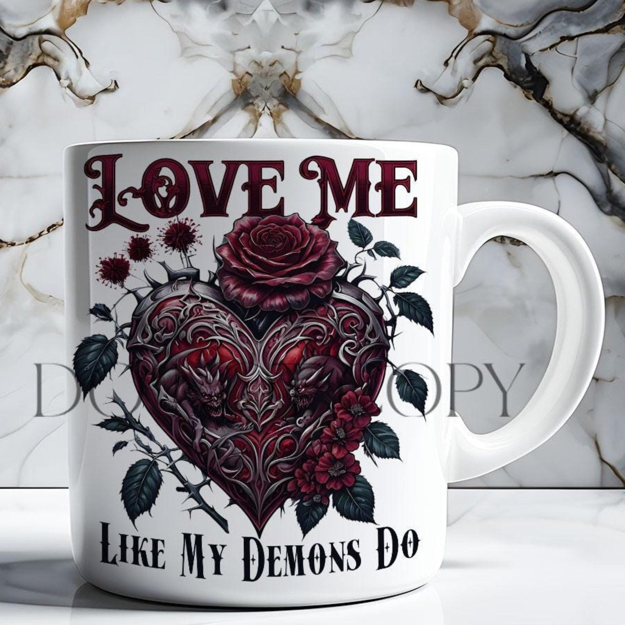 White mug with red heart and floral design on a marble background