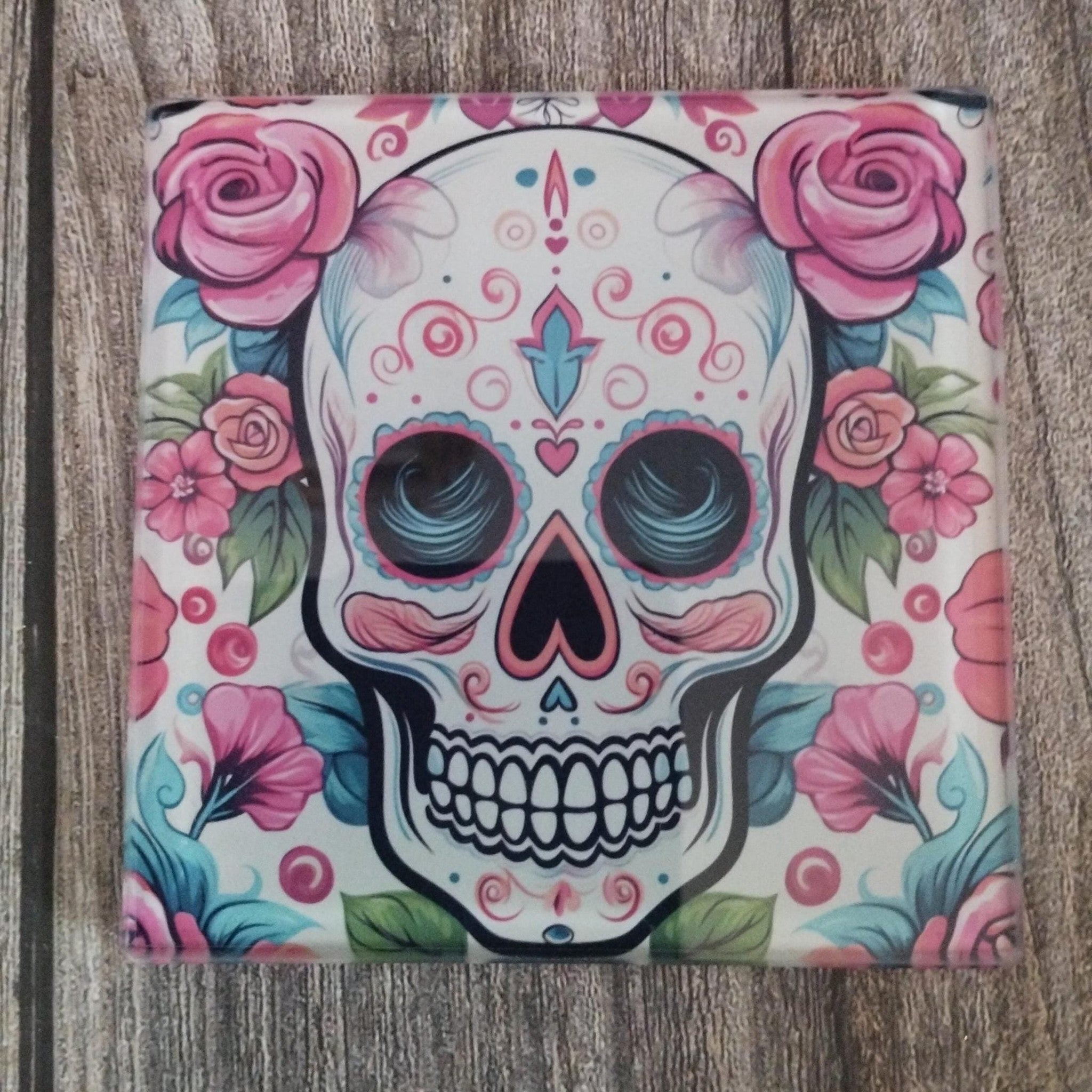 Colorful skull design with flowers on a wooden surface