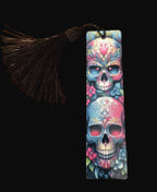 Colorful skull design bookmark with tassel on a wooden surface