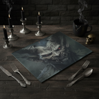 Glass tablemat with a devil image on an old table