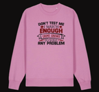 Pink sweatshirt with text design on a white background