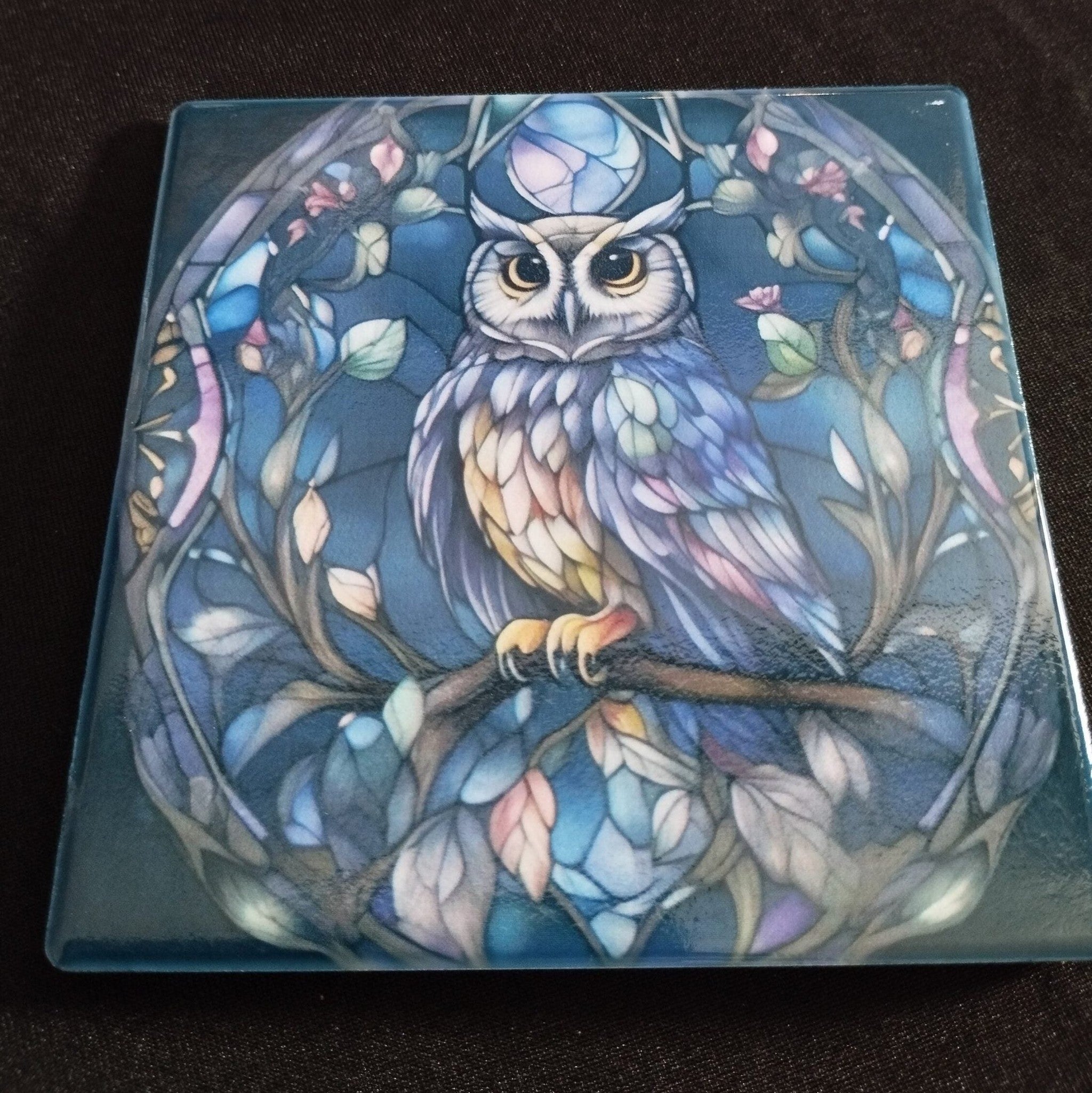 Decorative box with a colorful owl design on a dark background