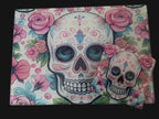 Colorful skull and floral design on a wooden surface