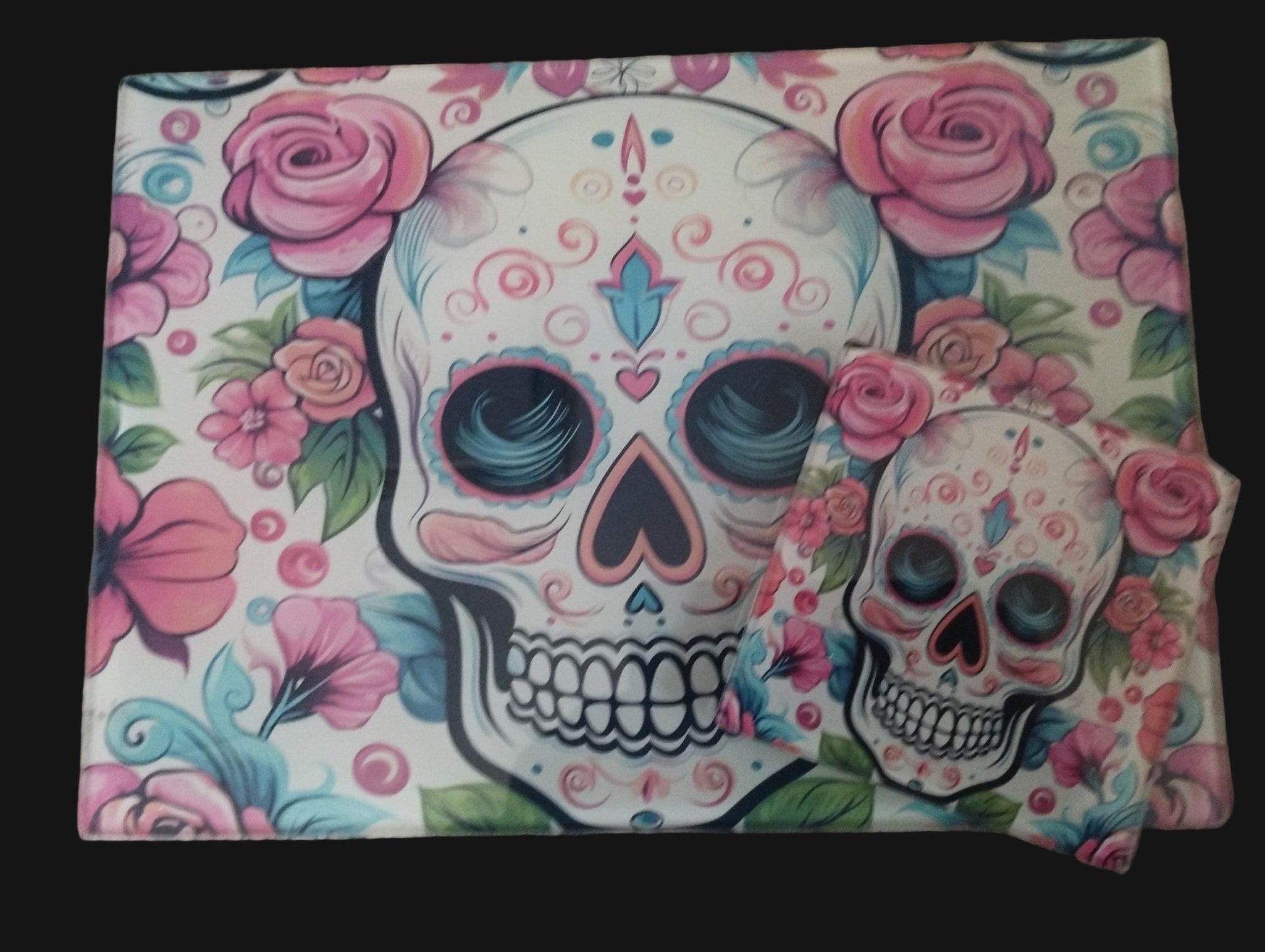 Colorful skull and floral design on a wooden surface