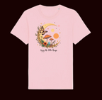 Pink t-shirt with a nature-themed graphic and text on a white background