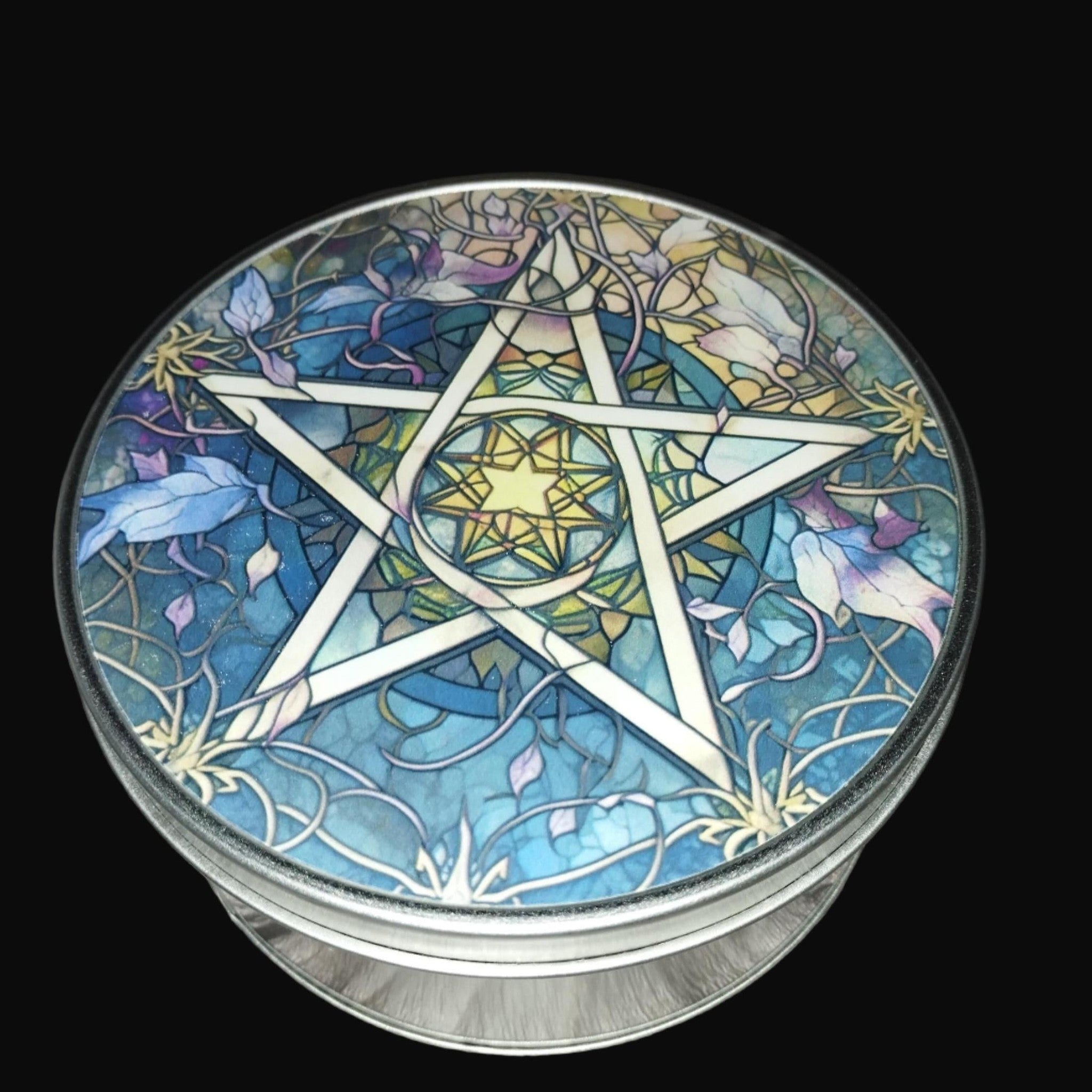 Decorative tin with a pentagram design on a wooden surface