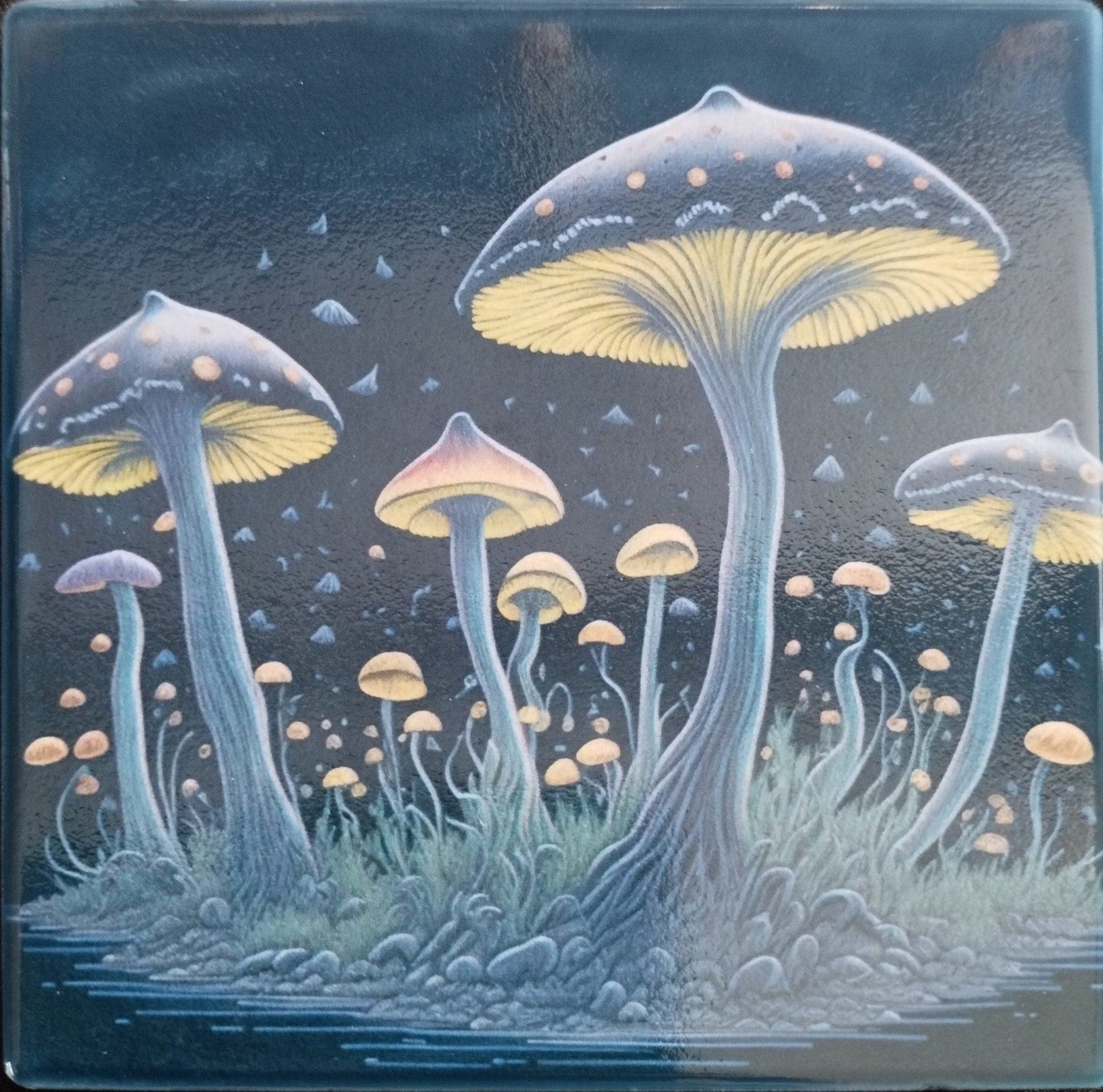 Ceramic Coaster with  mushrooms with yellow caps and blue stems on a dark background