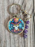 Skeleton keyring with amethyst crystals and a charm