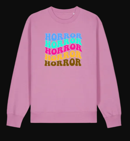 Pink sweatshirt with 'Horror' text in colorful letters on a white background