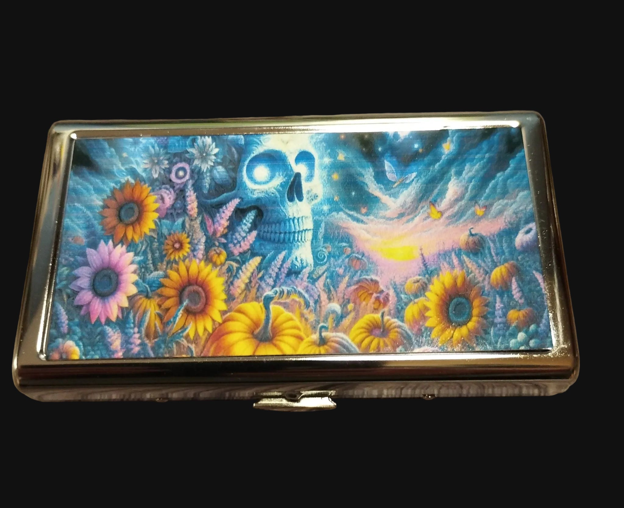 Colorful case with a skull and floral design on a wooden surface