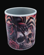 Mug with skull and spider design on a wooden surface