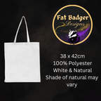 A white natural cotton canvas tote bag with two shoulder straps, shown on a dark background with product details. The image includes the 'Fat Badger Designs' logo and text stating '38 x 42cm', '100% Polyester', 'White & Natural', and 'Shade of natural may vary'.