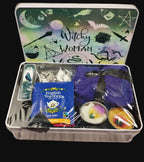 Witchy Woman themed gift set with tea, candle, and other items in a tin.